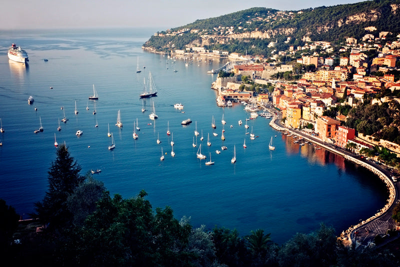 The stunning view of the bay of Villefranche sur Mer and the village beyond in the early morning light