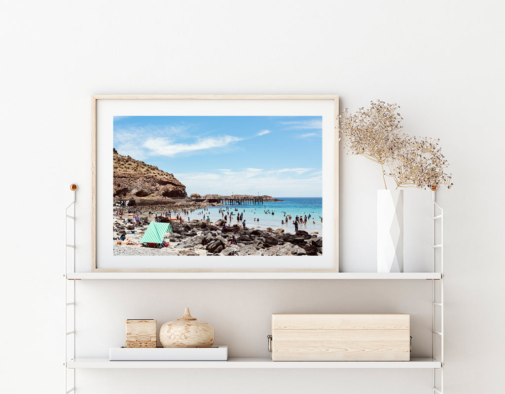 Beach and coastal wall art featuring the beach at Second Valley in South Australia on a summer day with beach tents on the sand and people in the ocean with a jetty and hill in the background