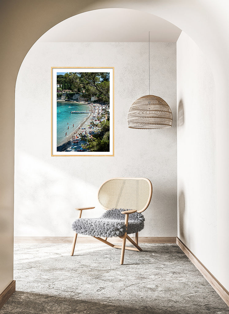 French Riviera wall art beach print featuring Paloma beach on a busy summer day with people enjoying the water and the beach under the beach umbrellas 