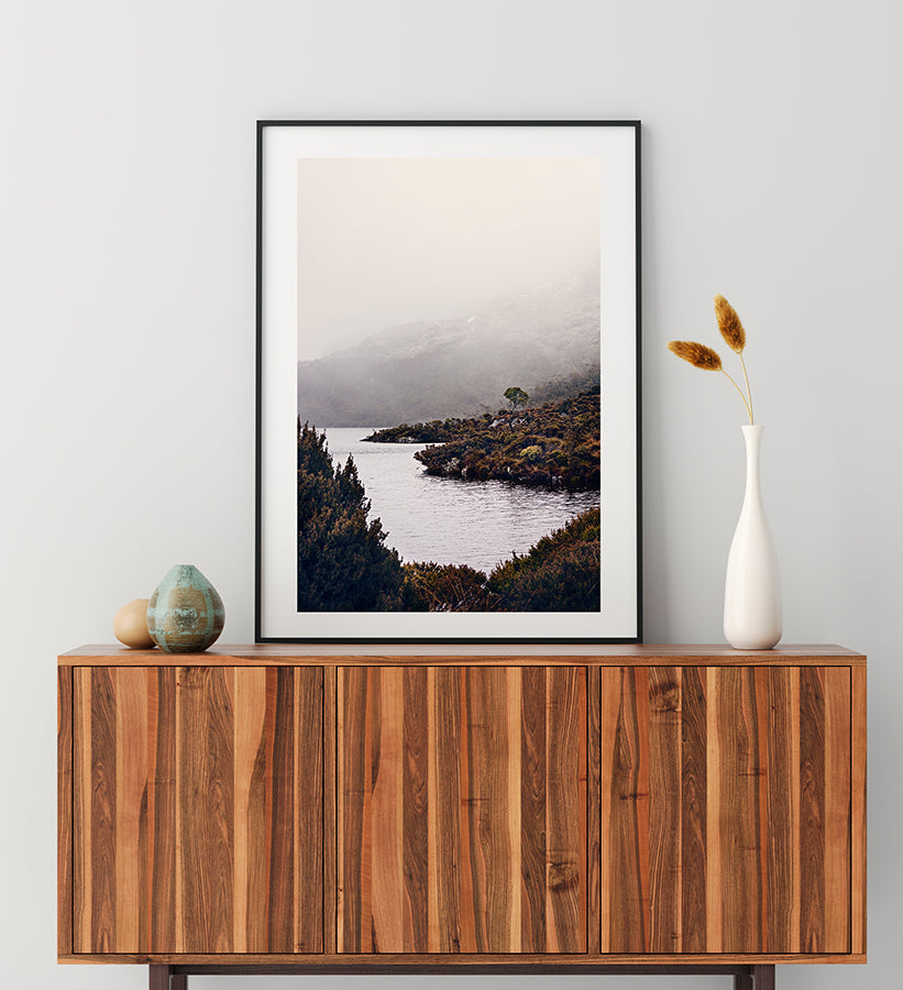 Cradle Mountain wall art print featuring Dove Lake in the Cradle Mountain National park Tasmania surrounded by bushland and low winter cloud shot by Millie Brown