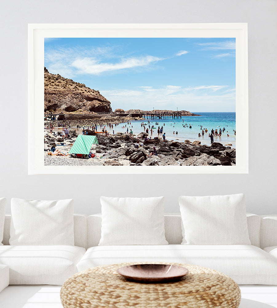 photographic beach wall art beach print featuring the Australian beach of Second valley beach with its blue water and colourful beachgoers featuring a green and white sun shelter in the foreground from the Salty Days collection of wall art