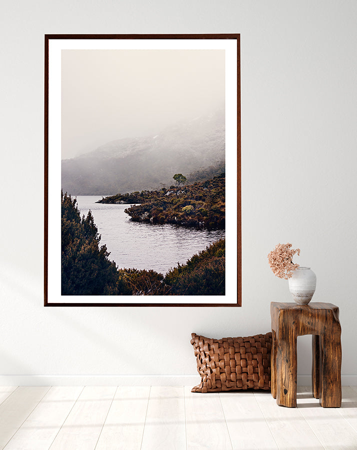 Cradle Mountain fine art print featuring Dove Lake in the Cradle Mountain National park Tasmania surrounded by bushland and low winter cloud shot by Millie Brown