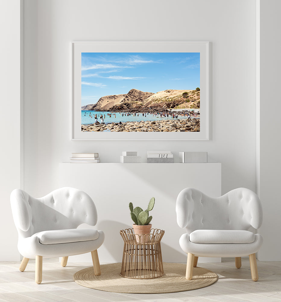 Wall art Australia featuring Second Valley a south australian beach with the dramatic cliffs in the background and beachgoers in the sea, wall art by photographer Millie Brown