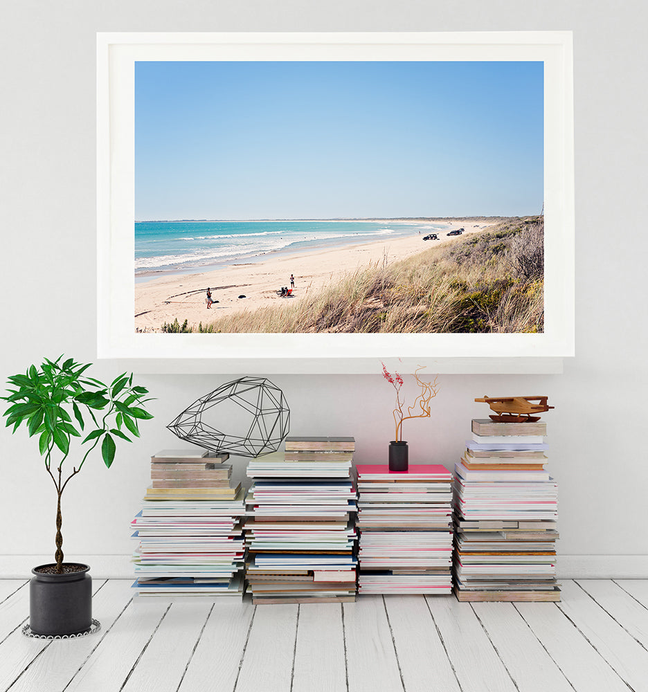 Long Beach robe print featuring the grassy sand dunes and the acquamarine ocean with people and cars on the white sand and a big blue sky. Limited edition fine art print by Millie Brown 