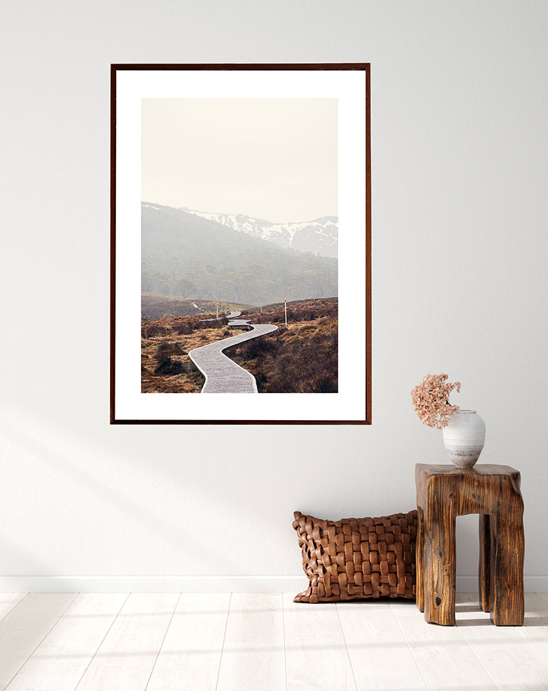 Cradle Mountain Wall art prints featuring the beautiful wilderness of Cradle Valley in Cradle Mountain National Park Tasmania and its boardwalk meandering through the button grass plains with the snowy mountains in the background by photographer Millie Brown