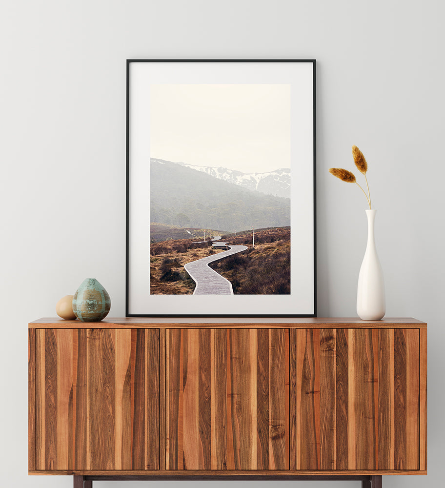 Cradle Mountain Photographic fine art prints  featuring the beautiful Tasmanian landscapes of Cradle Mountain National Park  with its walking trail  meandering through the button grass plains with the snowy mountains in the background by photographer Millie Brown